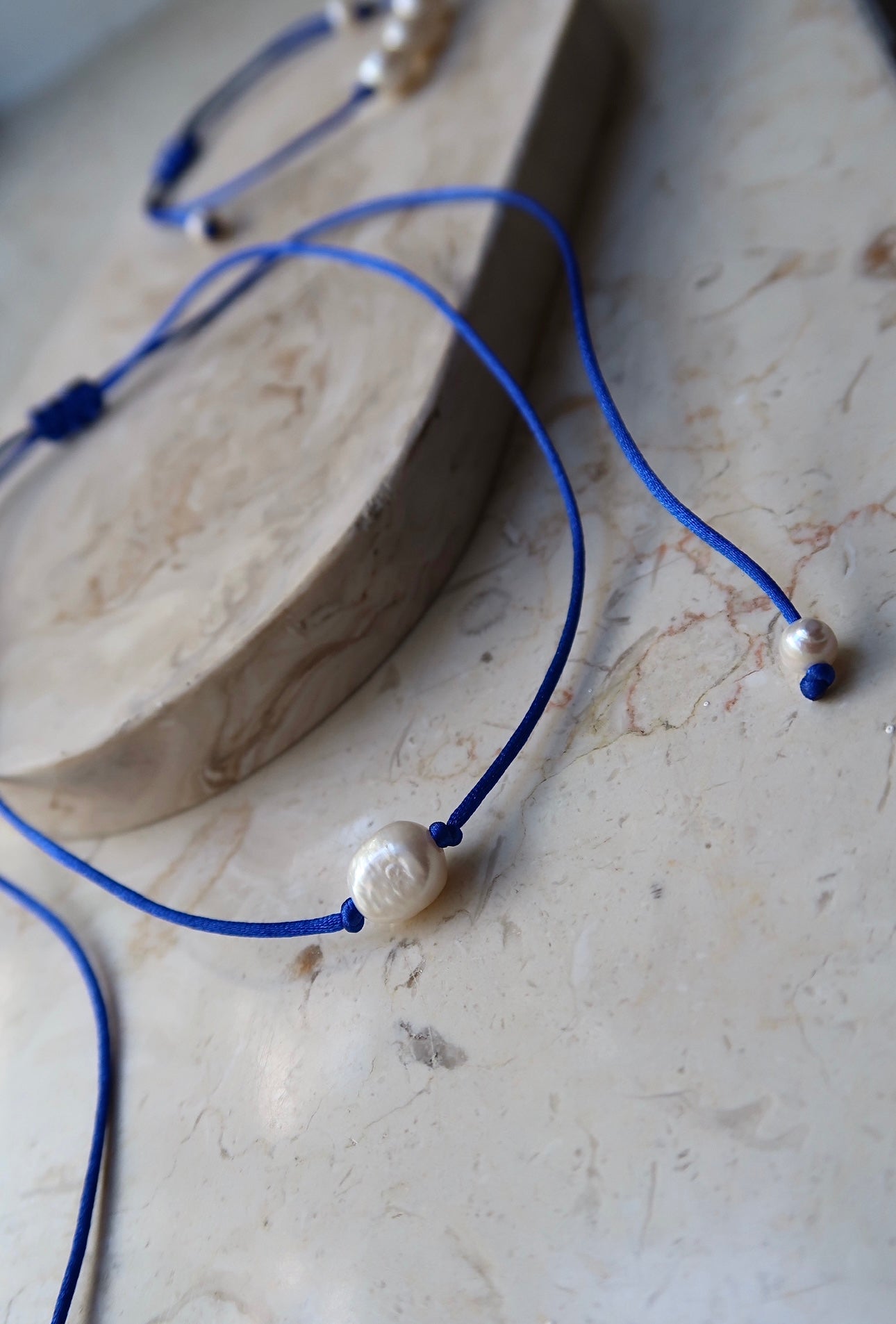 One pearl necklace blue